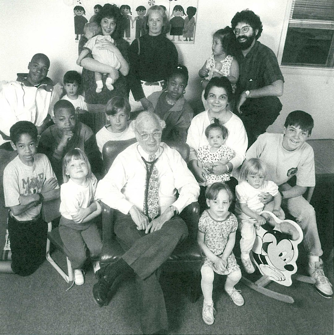 Dr. Wessel surrounded by children.